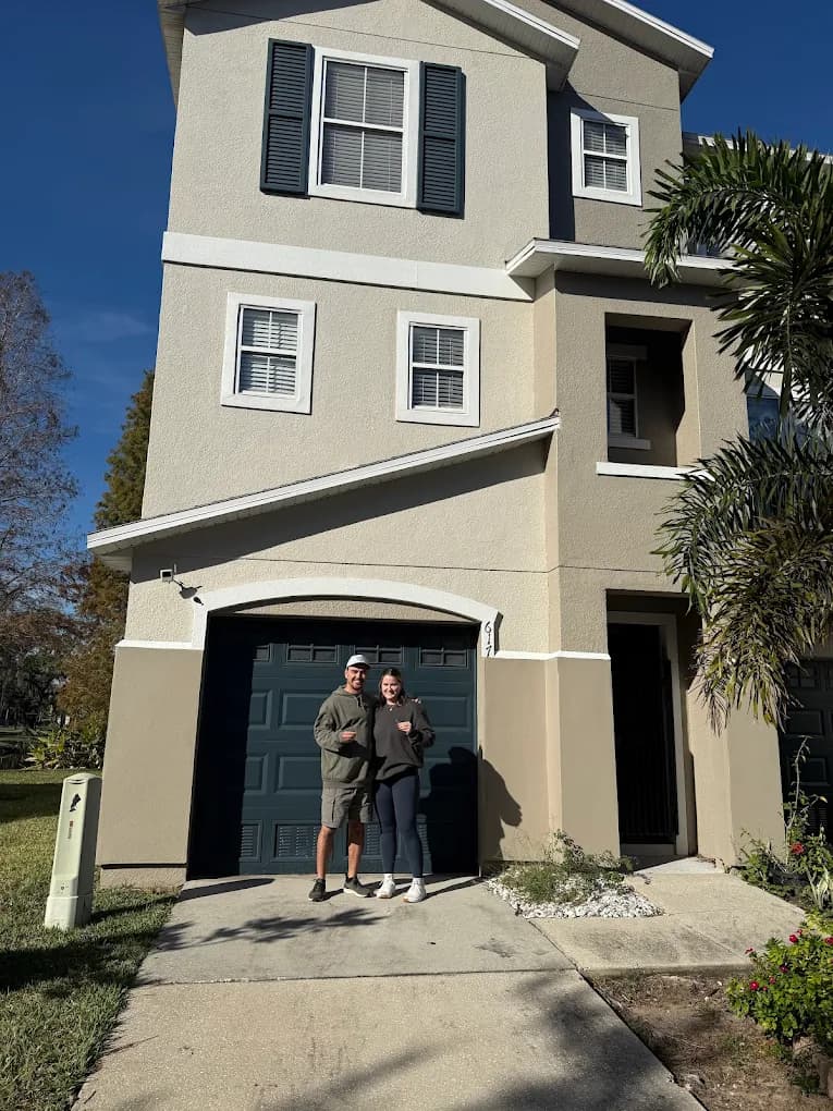 Couple in front of their new Tampa Bay townhome